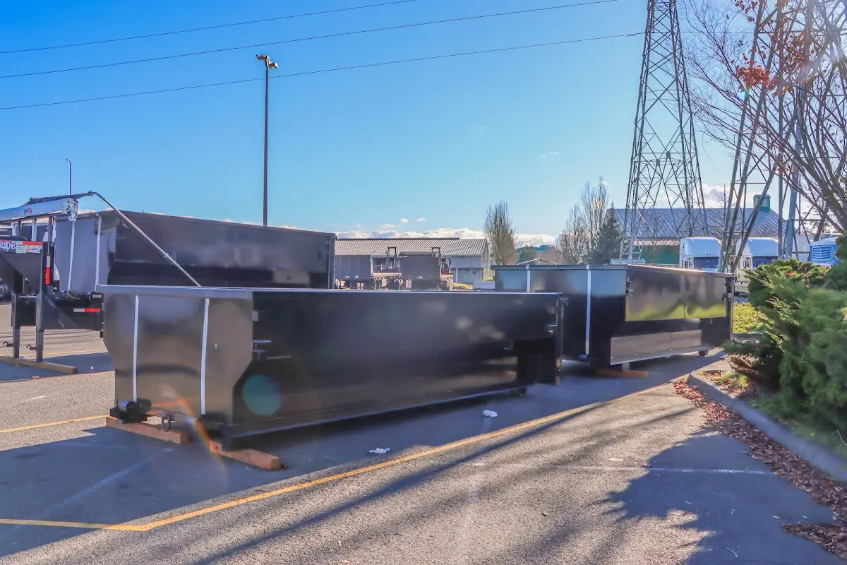 Roll-off dumpster ready for waste disposal at job site for Concrete Dumpster Rental in Ozark